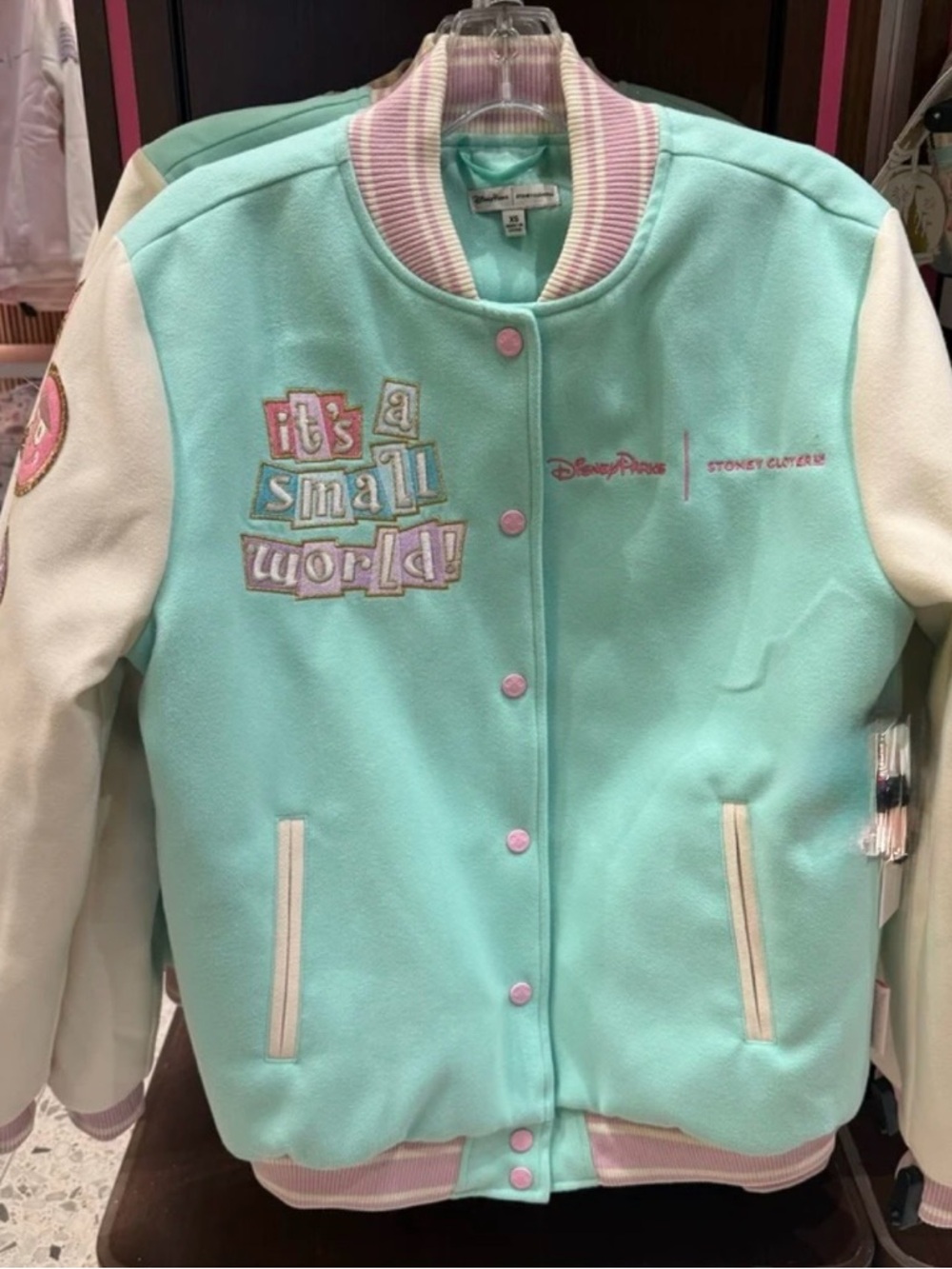 Disney mint & ivory "It’s a Small World" varsity bomber jacket stoney clover